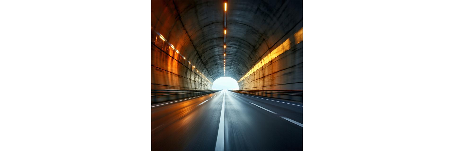 Blurred image of a highway tunnel entrance in Austria conveying speed and modern infrastructure